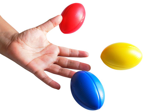Hand exercise ball, Squeezing ball with blue, yellow and red rugby balls isolated on white background.