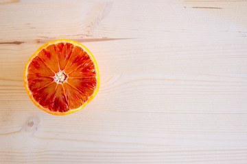 Red Sicilian oranges full of vitamins on the wooden background, special Mediterranean diet