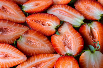 background of slices of fresh strawberries.