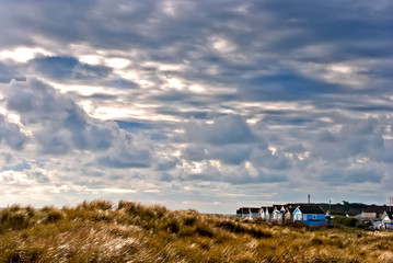 Fototapeta premium Hengistbury Head beach and beach huts near Bournemouth in Dorset, England
