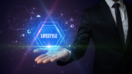 Man hand holding LIFESTYLE inscription, social media concept