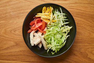 Chicken salad with vegetables and mixed greens. Delicious healthy eating.