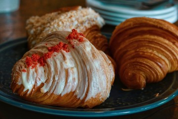 closeup lychee croissant on wood table