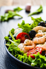 Prawn salad on black stone board