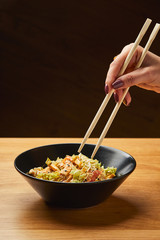 Chicken salad with vegetables and mixed greens flavored sesame seeds. Delicious healthy eating.