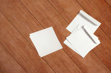 White envelopes and post cards on background. Top view blank envelopes mockup and blank letterhead presentation template. Empty sheets for your design.