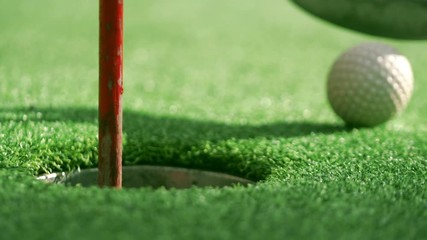 Man swinging golf cub and hitting a ball in 4k slow motion 60fps