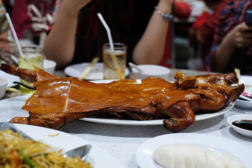 barbecued sucking pig on table for chinese newyear
