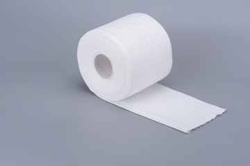 White toilet roll under a gray background