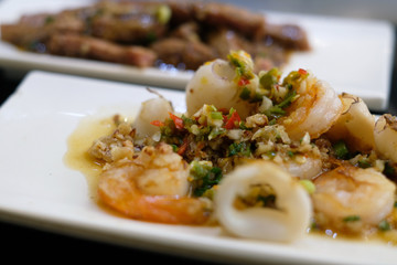 spicy seafood grilled on white dish