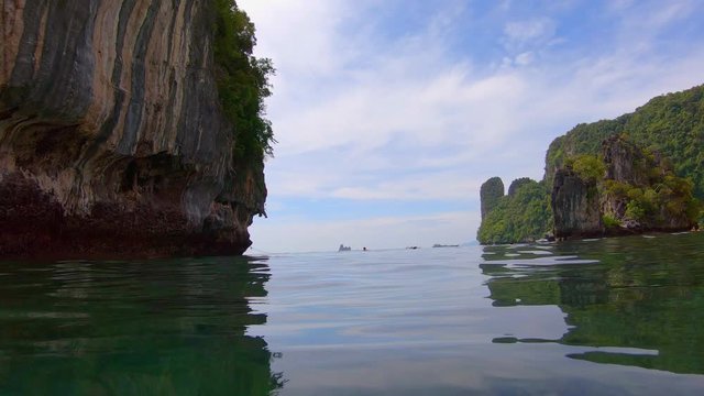 SLOW MOTION |  Islands around a bay in Thailand. Camera goes underwater at the end of clip