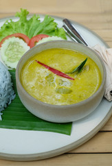 closeup green curry on banana leaf