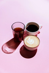 Coffee cup on pink background isolated copy space