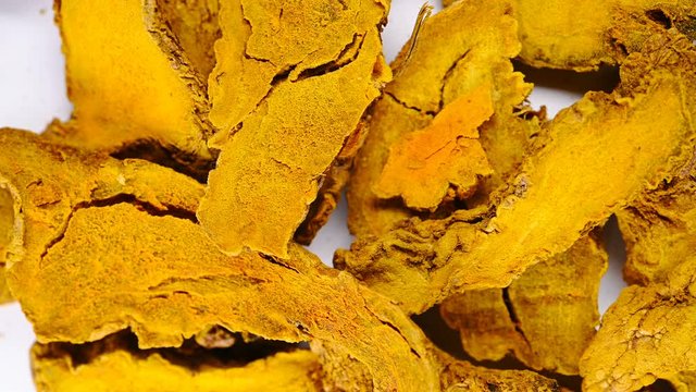 top view herb medicine JiangHuang or Curcumae Longae Rhizoma or Common Turmeric Rhizome rotate and pause