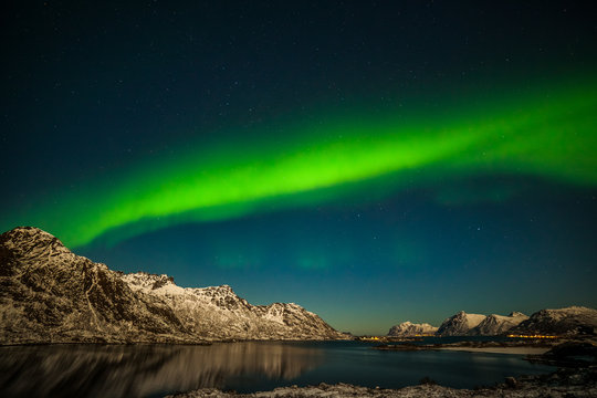 amazing northern lights, aurora borealis over the mountains in the North of Europe - Lofoten islands, Norway © Tatiana