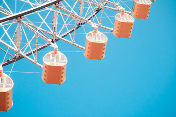 Ferris Wheel Over Blue Sky Background