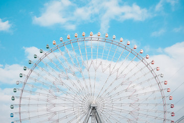 Ferris Wheel Over Blue Sky Background