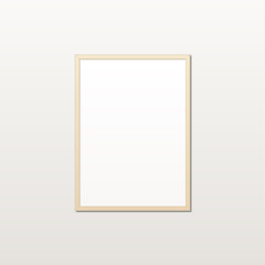 Obraz premium Realistic white poster in a wooden frame on a light wall