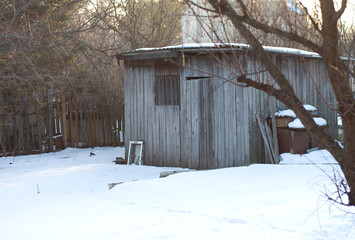 Old wooden shed in winter