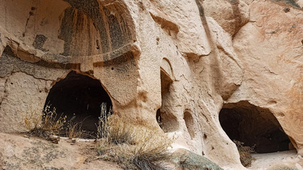 Cave houses and monasteries carved into Tufa Rocks at Zelve Open Air Museum (Zelve Valley) in winter season in Cappadocia, Turkey