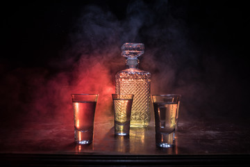 Vodka in bar on a glass table, focus on glass. Club drink concept.