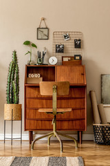 Retro interior design of art workshop room with wooden vintage bureau and chair, decor, plants,...