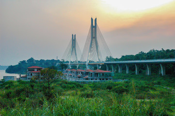 Bridge of Corniche in haze at sunset in Brazzaville at 2018.