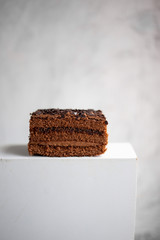 German Chocolate Cake with a Coconut Icing on marble background with copy space
