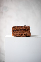 German Chocolate Cake with a Coconut Icing on marble background with copy space