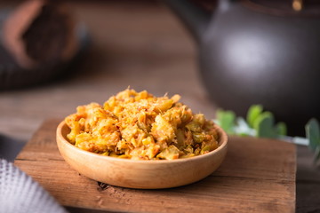 Pickled chili sauce is in a bowl. It's a kind of Korean kimchi. It's served with rice in Asia or China
