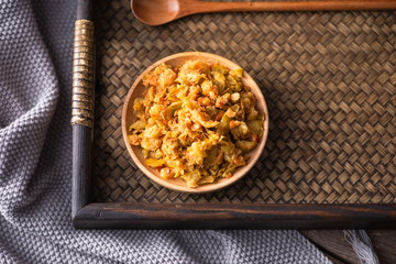 Pickled chili sauce is in a bowl. It's a kind of Korean kimchi. It's served with rice in Asia or China