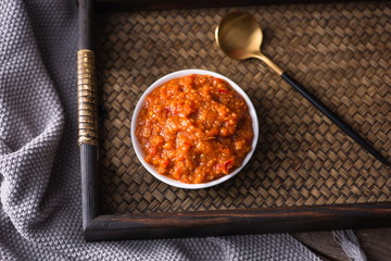 Pickled chili sauce is in a bowl. It's a kind of Korean kimchi. It's served with rice in Asia or China