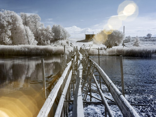unusual landscape with wooden bridge over river
