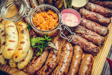 a set of different sausages, grilled on plate