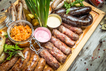 a set of different sausages, grilled on plate