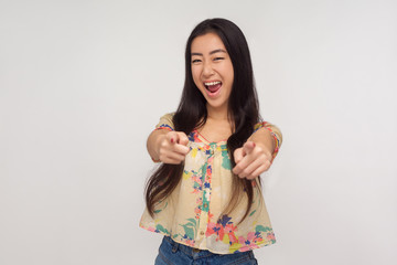 Hey you! Joyful enthusiastic asian girl in summer blouse pointing at camera, choosing successful...