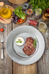 Tenderloin steak on plate with sauce