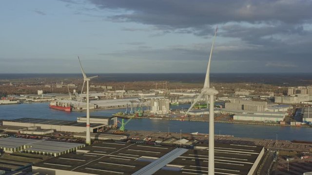 Antwerp Belgium Aerial v37 Flying around wind turbines in industrial area - November 2019