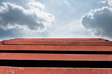 Red wooden stairway to the sky. Abstract natural backgrounds