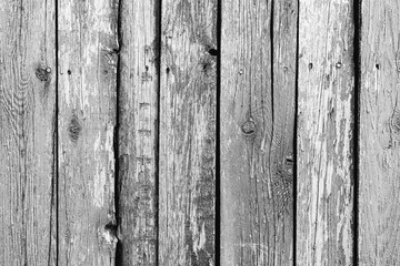 Wooden texture of grey color with scratches and cracks, which can be used as a background