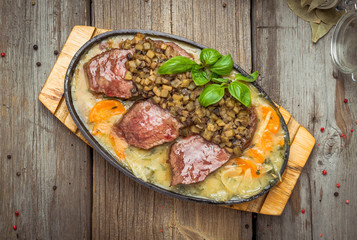 fried chicken breast with vegetables on frying pan