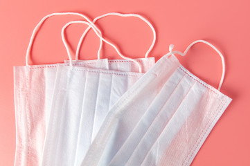 Medical mask isolated on a pink