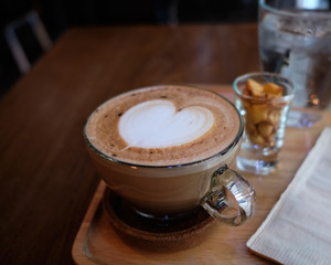 cup off hot coffee on table closeup