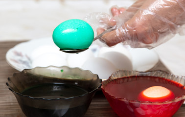 Painting eggs in the kitchen.