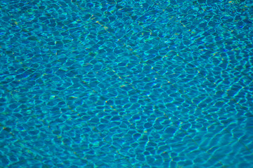 A backgroung view of blue water in the pool outdoor