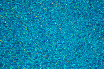 A backgroung view of blue water in the pool outdoor