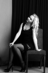 Fashion photo of young lady in elegant black dress