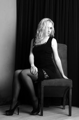 Obraz na płótnie Canvas Fashion photo of young lady in elegant black dress
