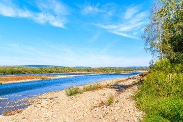 View of Poprad river near Velo Dunajec cycling road, Beskid Sadecki Mountains, Poland