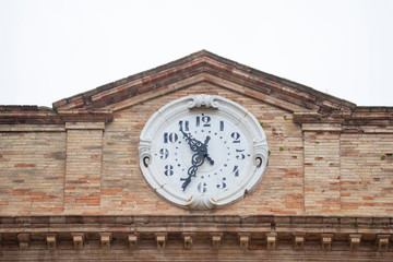 Fototapeta na wymiar Old Townhall Clock in Loreto (Ancona, Italy)